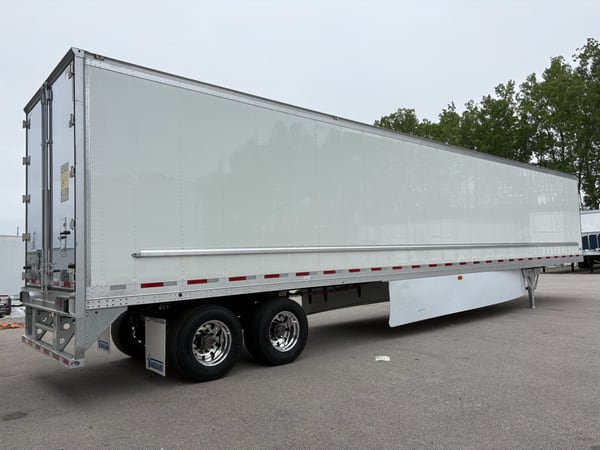 Vanguard refrigerated trailer, front three-quarter view, parked at a dealer location
